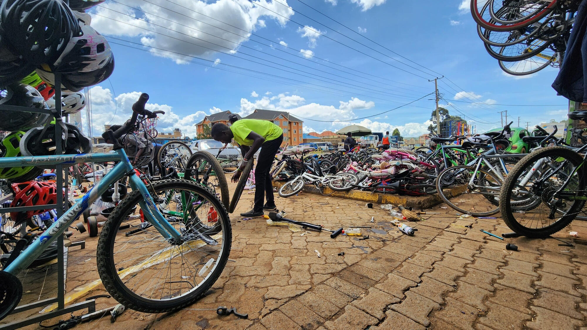 Bicycle mechanic repairing a puncture Bicycle mechanic repairing a puncture